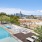shaded lounge deck next to swimming pool