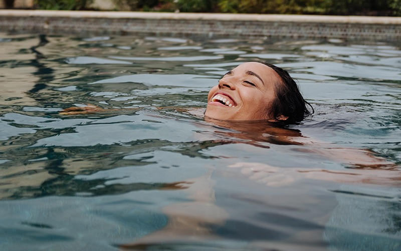 Woman swimming in the pool 