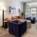 a living room with a couch and chairs