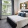 a room with a bed and a large window