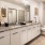 a bathroom with a large vanity and a shower